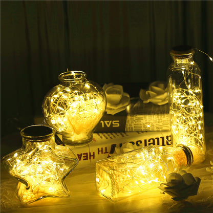 Glass bottle with gypsophila lights